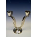 Modern Design - a Spanish silver two-light table candelabra, conical sconces, serpentine branches,