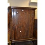 An 18th century oak wall hanging corner cupboard