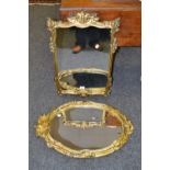 A gilt framed oval wall hanging mirror,
