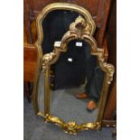 A shaped rectangular gilt mirror ,