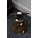 A Blacksmith's part anvil, on wooden plinth,