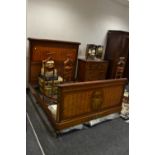 An Edwardian mahogany double bed,