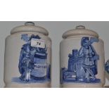 A pair of 20th century Delft tobacco jars, printed in blue with natives smoking,