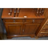 A 20th century sideboard two short drawers over two doors