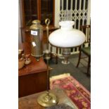 A 20th century brass oil lamp, white shade,