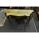 A green marble top console table