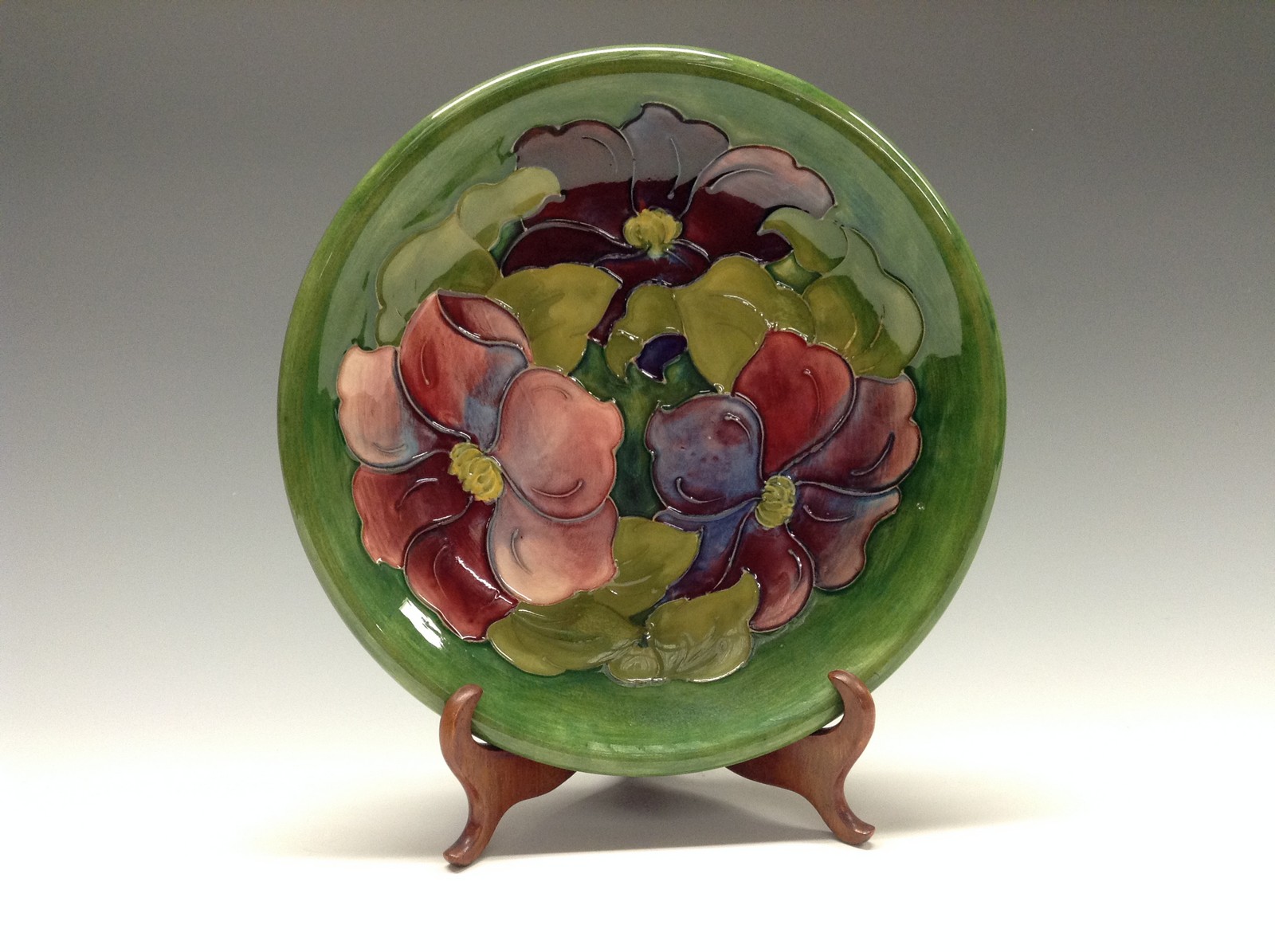 A Moorcroft Anemone pattern circular plate, tube lined with large flowerheads and foliage,