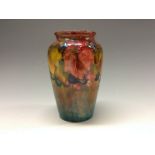 A Moorcroft Leaf and Berry pattern ovoid vase, tube lined with large autumn leaves and berries,