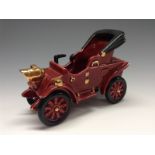 A Bretby novelty model of an early 20th century motor car, claret glaze,