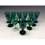 A set of six emerald glass wine glasses, etched with fruiting vine, knopped stems, 12.