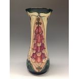 A contemporary  Moorcroft Foxglove pattern vase, of waisted cylindrical form,