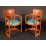 A pair of Frank Lloyd Wright barrel chairs by Cassina,