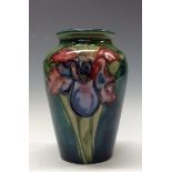 A Moorcroft Orchid pattern ovoid vase, tube lined with large flowers and foliage,