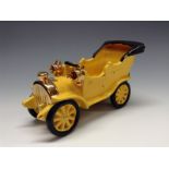 A Bretby novelty model of an early 20th century motor car, yellow glaze,