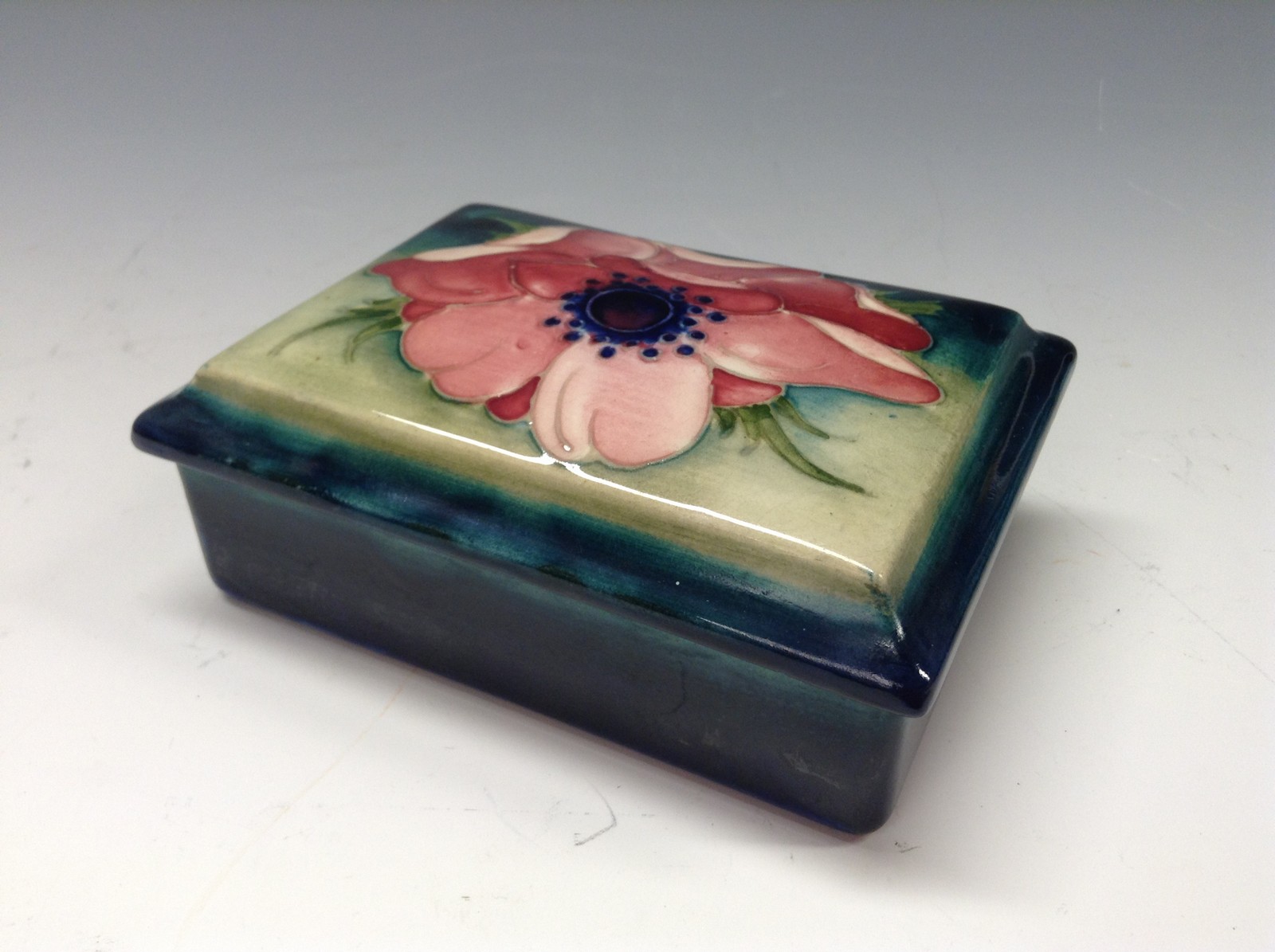 A Moorcroft Poppy pattern rectangular powder bowl and cover,