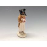 A Beswick Beatrix Potter's model, Pickles, standing wearing a white apron holding book and pencil,