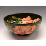 A Moorcroft Hibiscus pattern circular bowl, tube lined with large flowerheads and foliage,