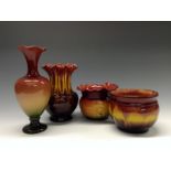 A Bretby baluster vase, glazed in merging tones of red, yellow, orange and green, wavy-edged lip,