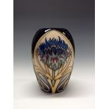 A contemporary Moorcroft Cornflower Cavalcade pattern vase,