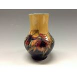 A Moorcroft Orchid pattern small baluster vase