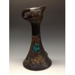 A Bretby Jewelled ewer, boldly applied with mottle glazed cabachons, loop handle, 32cm high,