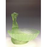 An Art Deco green glass table centrepiece, moulded with a mermaid and scollop dish, 25cm high, c.