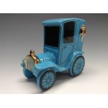 A Bretby novelty motor car money box, coin aperture, rubber stopper, blue glaze,