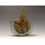 A Mdina studio glass fish vase, of axehead shape, with swirls in brown and mustard, 24cm high, c.