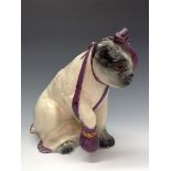 A Bretby model, After the Battle, the bulldog sits with a bandaged eye and its paw in a sling,