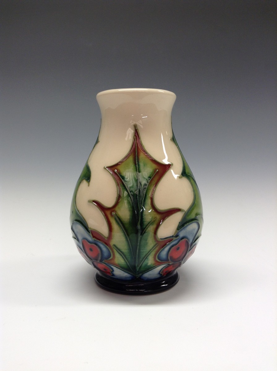 A contemporary Moorcroft Holly and Berries pattern vase,