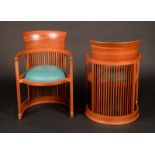 A pair of Frank Lloyd Wright barrel chairs by Cassina,