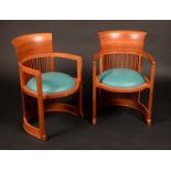 A pair of Frank Lloyd Wright barrel chairs by Cassina,