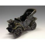 A Bretby novelty model of an early 20th century motor car, olive green glaze, 16.