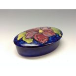 A Moorcroft Hibiscus pattern  oval dressing table pot and cover,