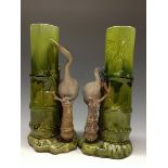 A pair of Bretby Aesthetic Movement spill vases, modelled with a kranes by bamboo shoots,
