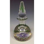 A Perthshire, Crieff Scotland glass bottle paperweight, green-based multi-coloured millefiori cane,