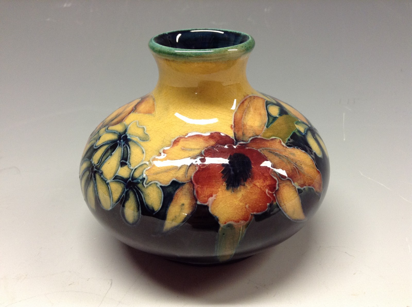 A Moorcroft Orchid pattern small orchid vase