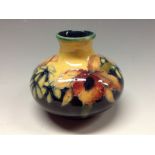 A Moorcroft Orchid pattern small orchid vase