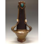 A Bretby Jewelled vase, matt shaped reserves,