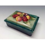 A Moorcroft Clematis pattern rectangular powder bowl and cover,