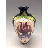 A contemporary Moorcroft Trial Fuchsia pattern vase,  tube lined with stylised flowers, 16.