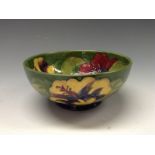 A Moorcroft Hibiscus pattern bowl, tube lined with large flowerheads in red,