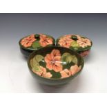 A pair of Moorcroft Hibiscus pattern powder jar and cover,