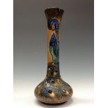 A Moorcroft Peacock vase, designed by Rachel Bishop, tube lined with stylised peacock,