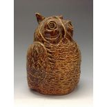 A salt glazed studio pottery owl door stop, brown glaze,