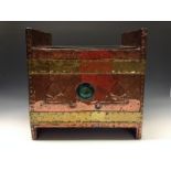 An Arts and Crafts copper and brass bound spreading rectangular fuel bin,