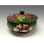 A Moorcroft Hibiscus pattern powder bowl and cover, tube lined with large flowerheads in red,