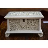 A Cantonese ivory rectangular jewel casket, carved overall with panels of peonies,