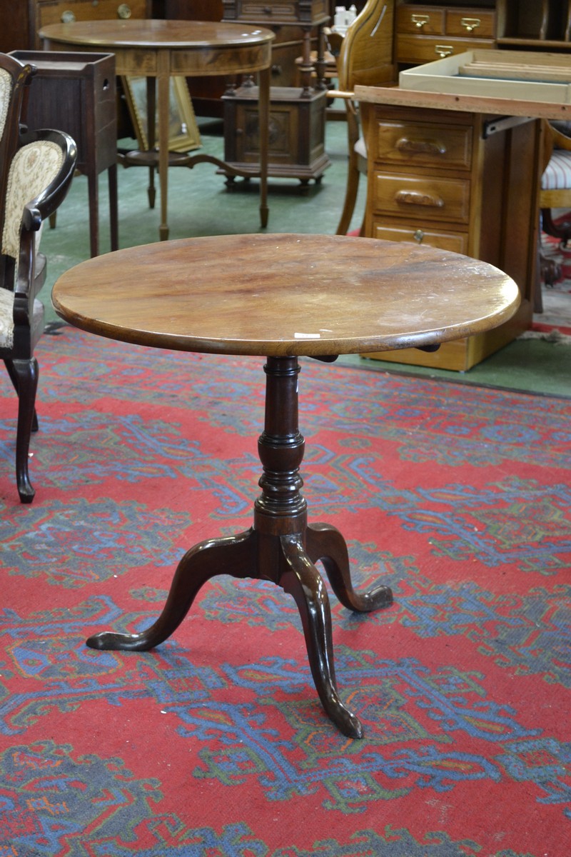 A George III mahogany tripod occasional table, circular tilting top, turned column, cabriole legs,