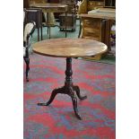 A George III mahogany tripod occasional table, circular tilting top, turned column, cabriole legs,